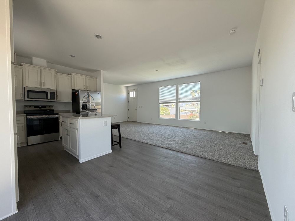 Open kitchen layout with island and upgraded finishes in North Phoenix AZ